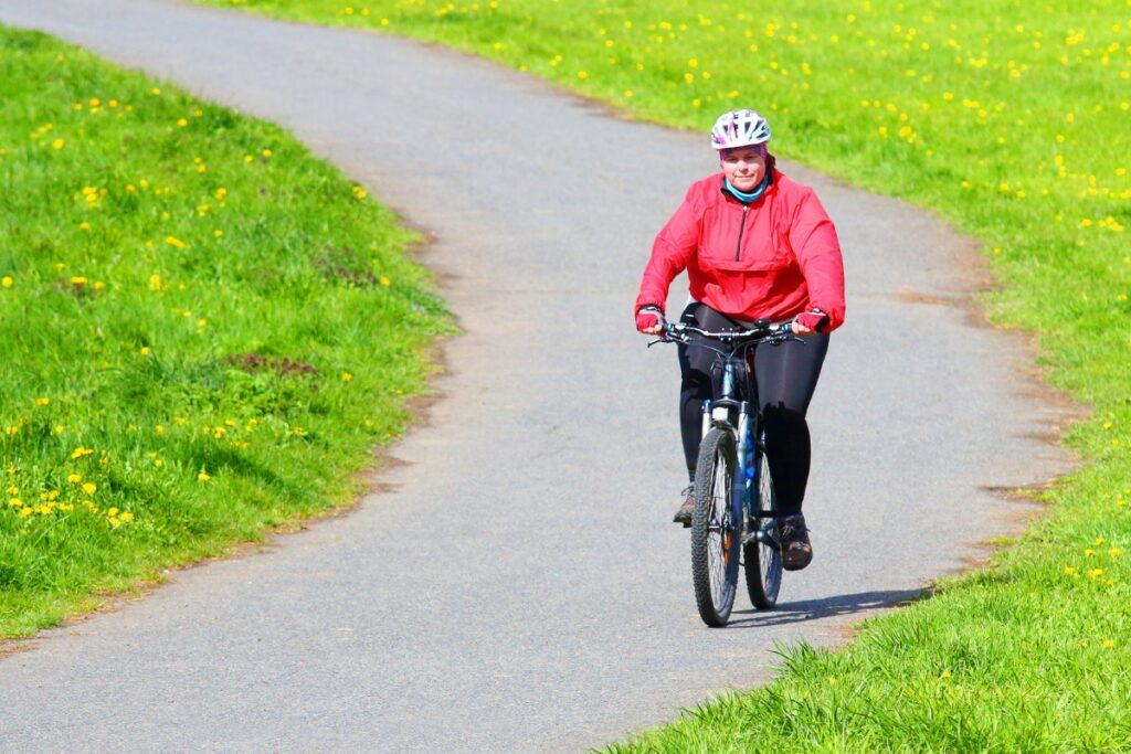 Cyclist riding bicycle for weightloss